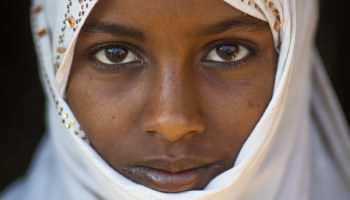 Portrait of an Afar tribe girl with a white veil, Afar region, Afambo, Ethiopia