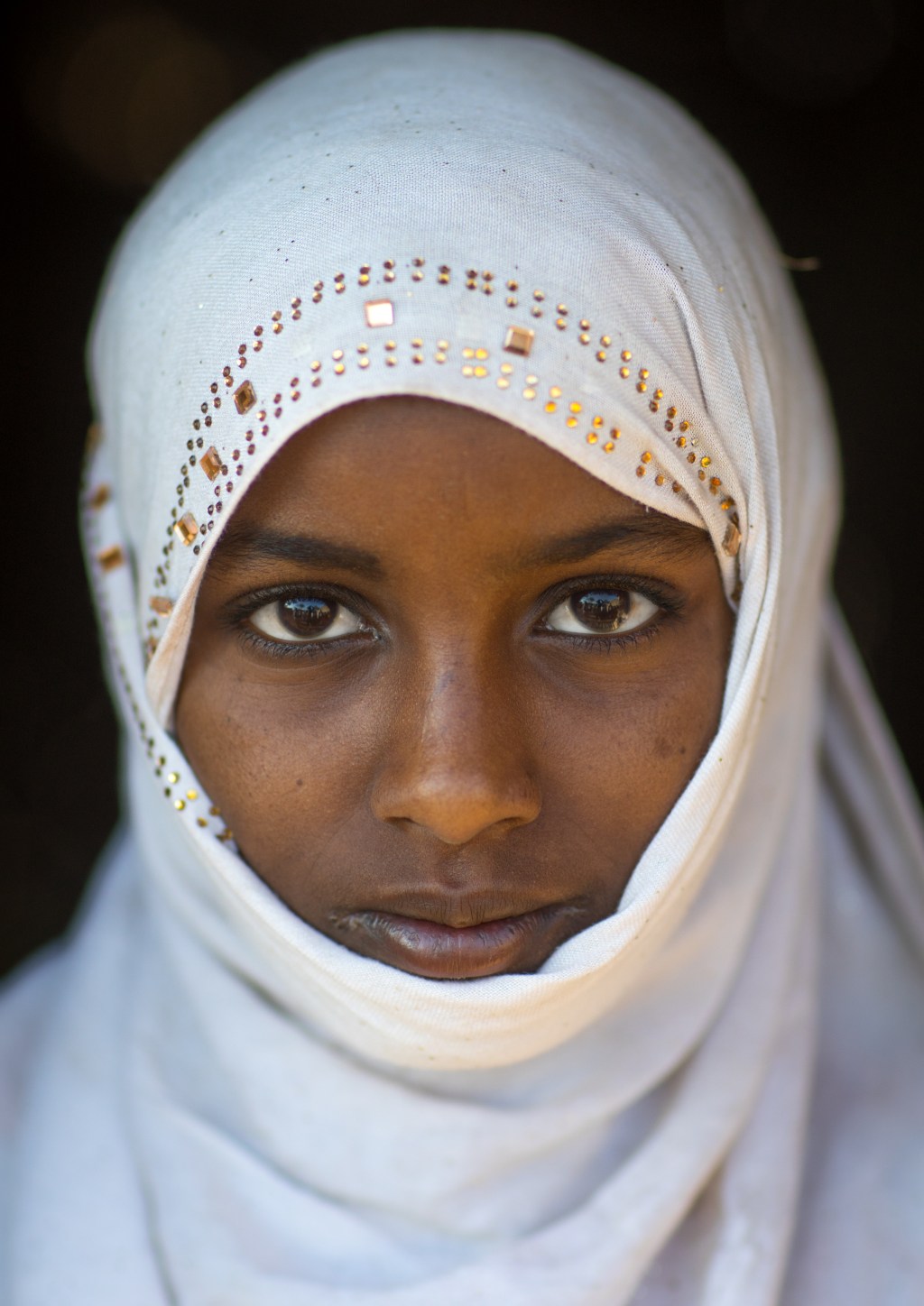 Portrait of an Afar tribe girl with a white veil, Afar region, Afambo, Ethiopia