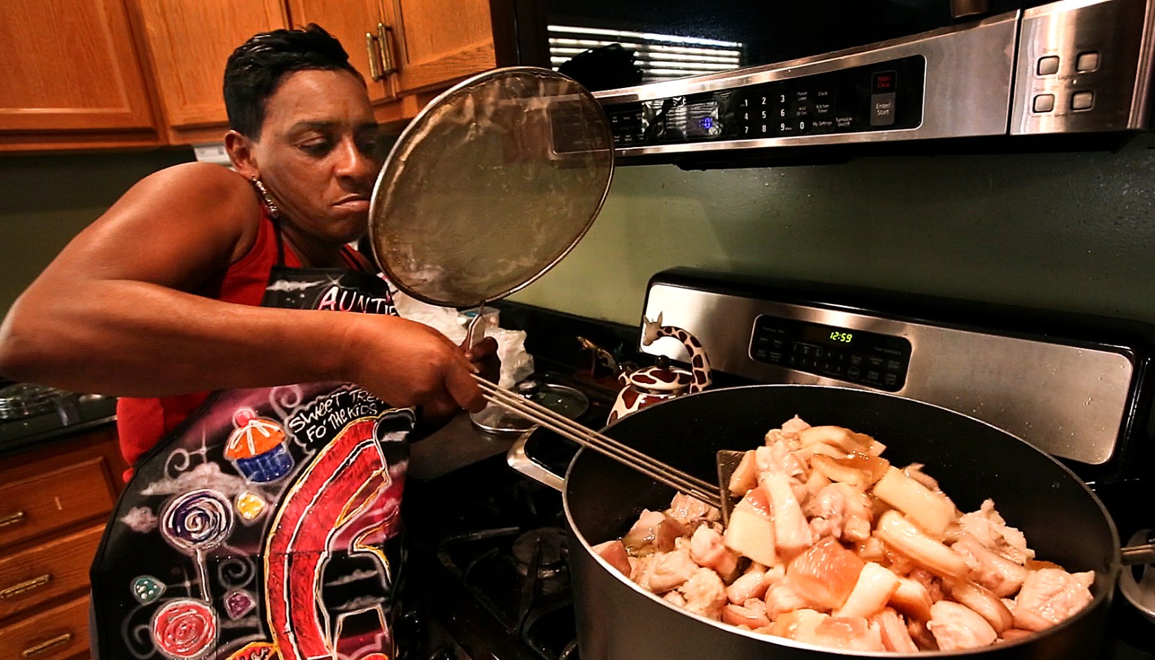 LOS ANGELES, CA-FEBRUARY 12, 2015: YouTube cooking sensation Felicia O'Dell protects herself from gr