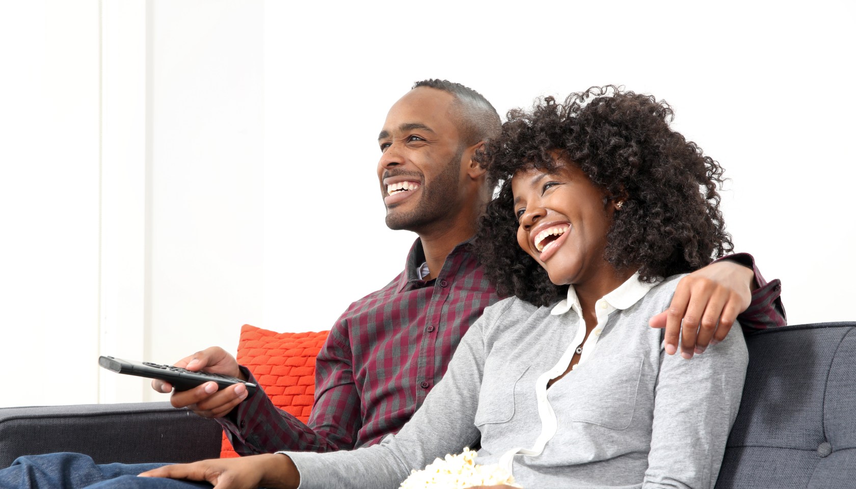 Young couple watching television.