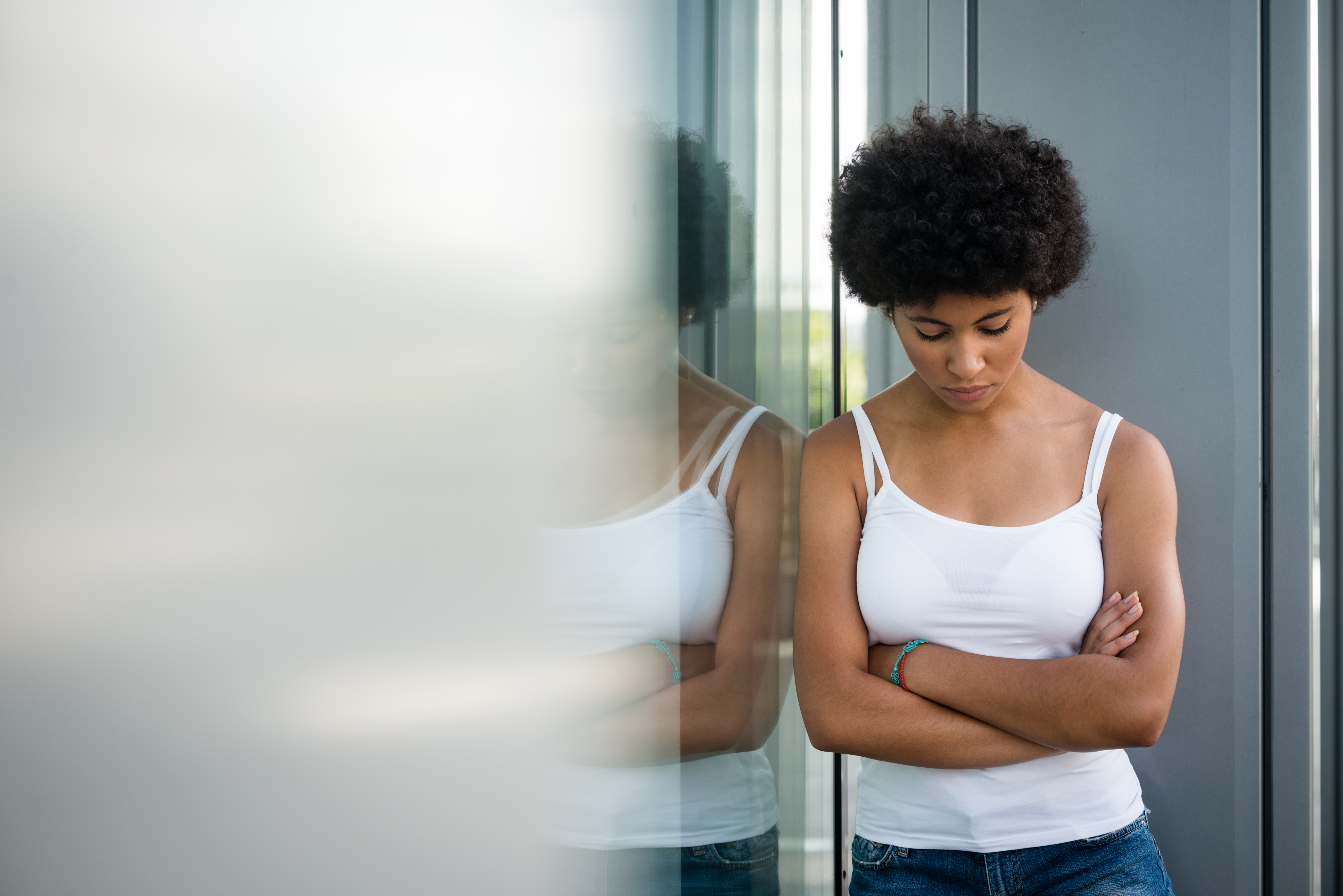 Disappointed young girl posing with folded arms