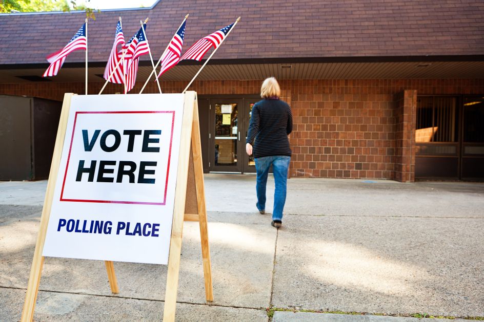 Woman Voter Entering Voting Polling Place for USA Government Election