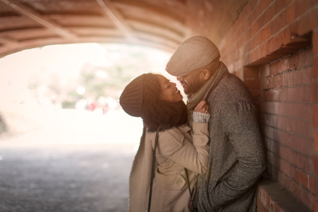 Romantic couple face to face in tunnel