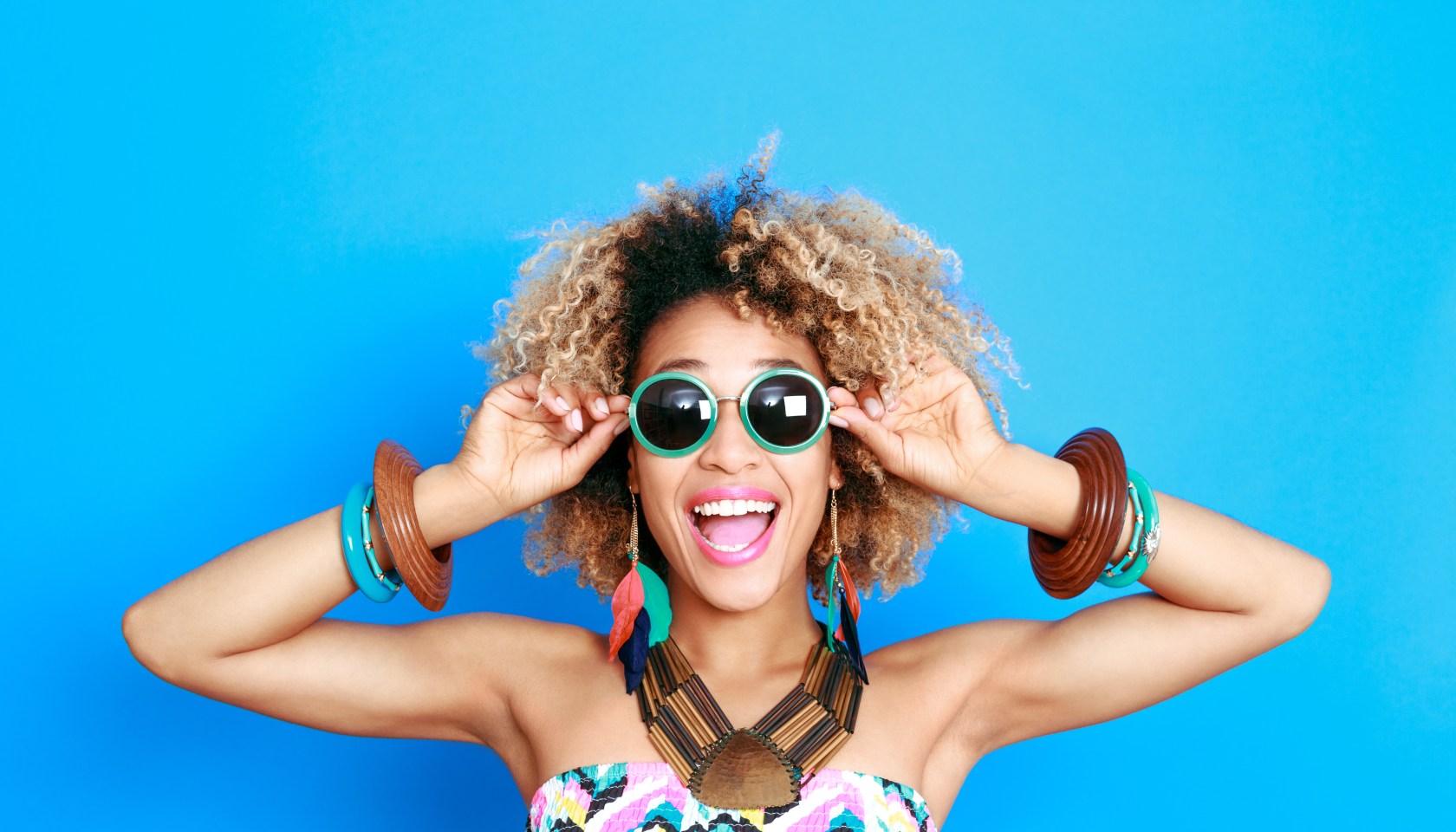 Summer portrait of excited afro american young woman
