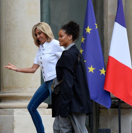 France’s First Lady Brigitte Macron escorts Rihanna inside Elysee Palace