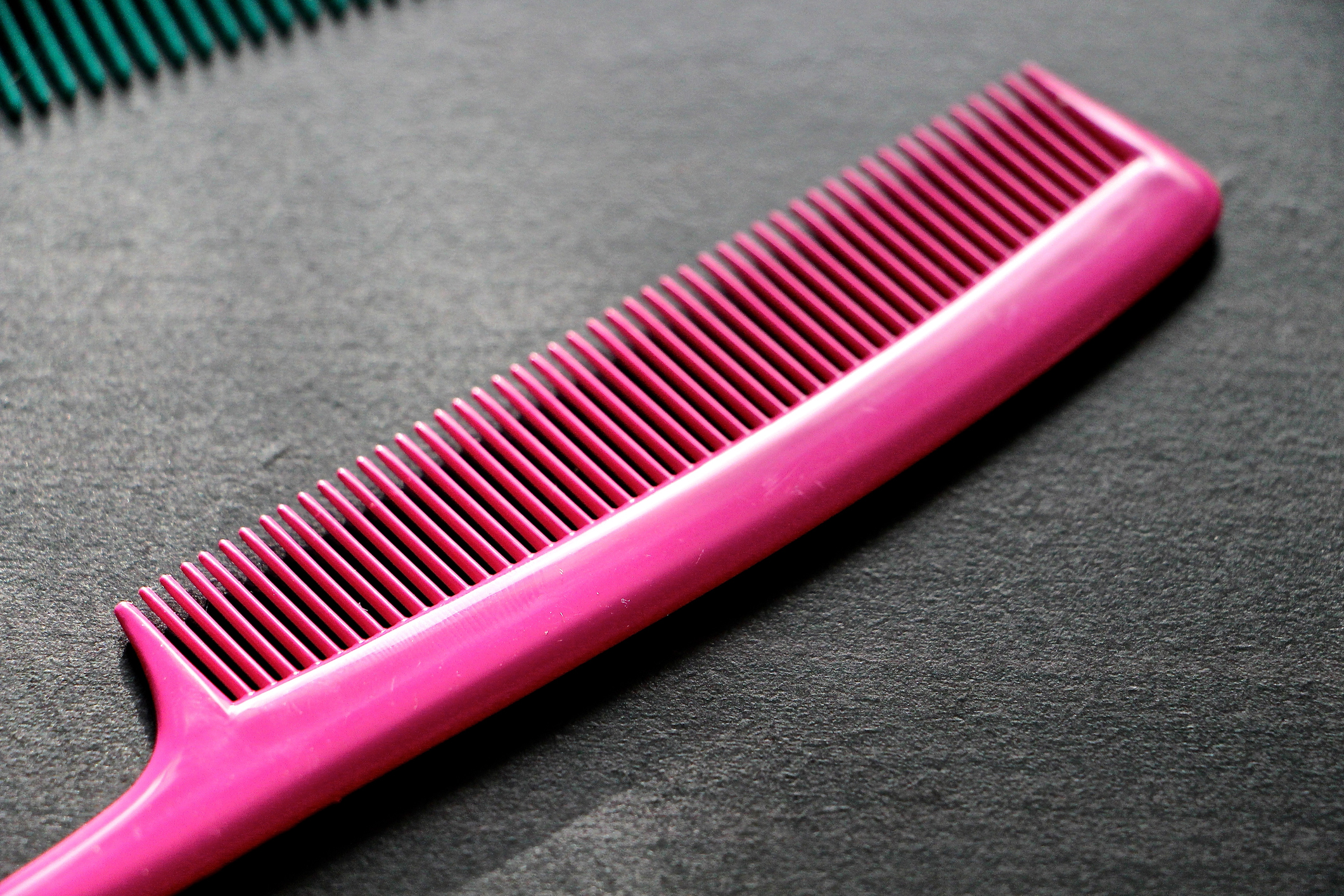 High Angle View Of Pink Comb On Table