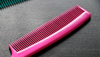 High Angle View Of Pink Comb On Table