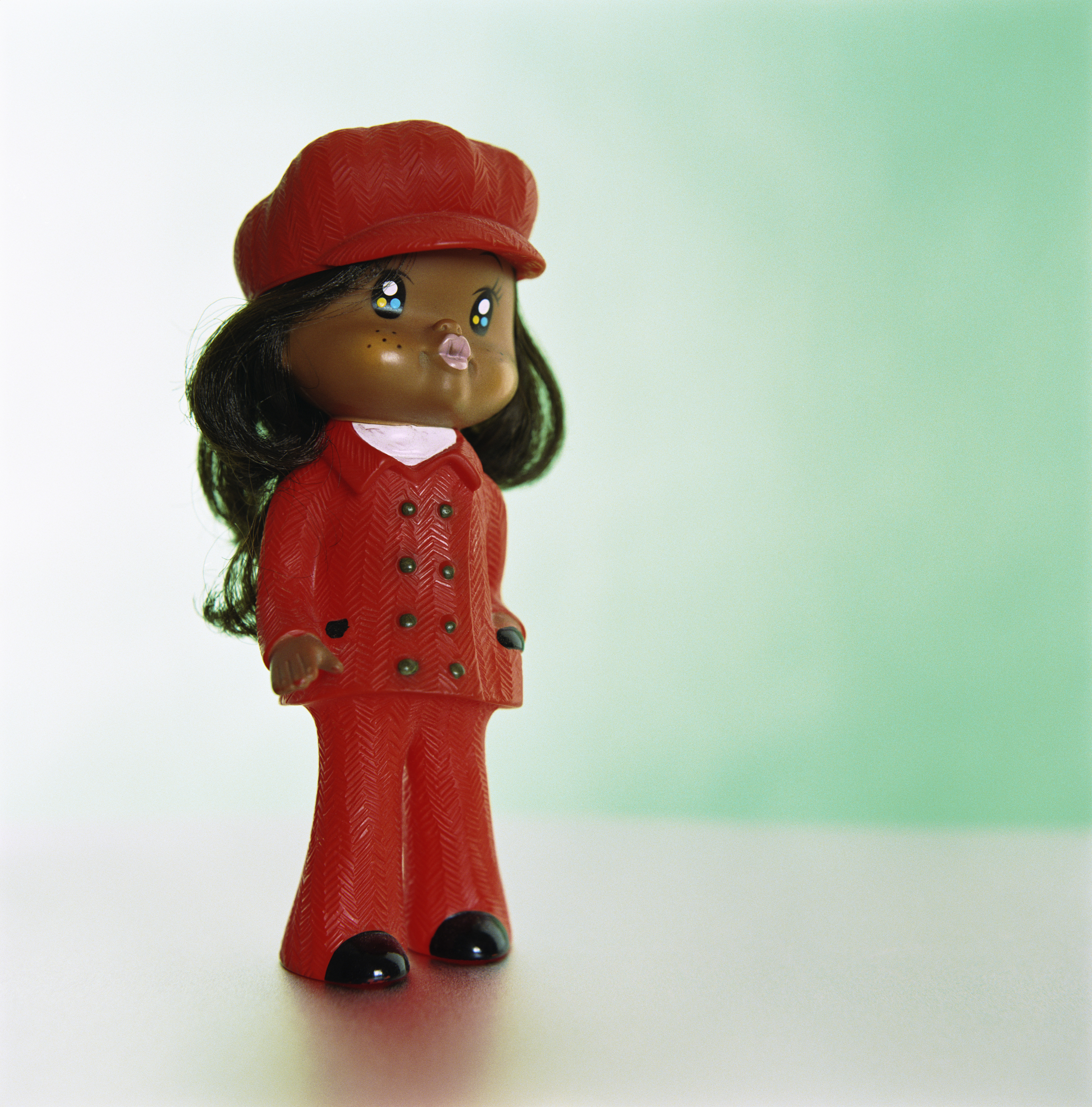 Doll wearing red leisure suit