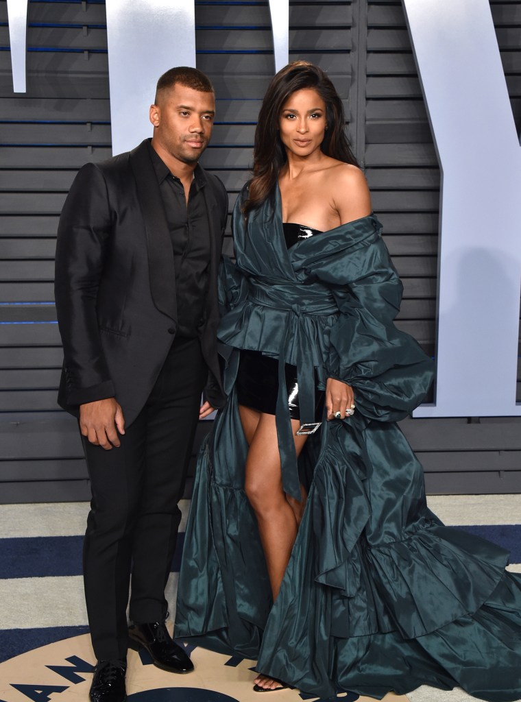 RUSSELL WILSON (L) AND CIARA (R)