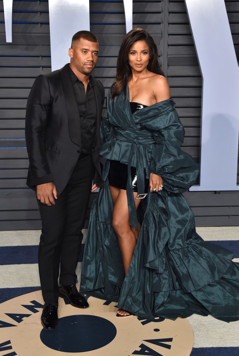 RUSSELL WILSON (L) AND CIARA (R)