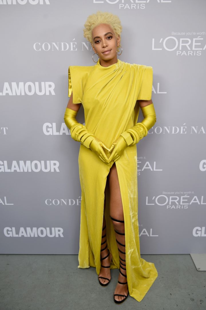 Solange werking the red carpet in a canary yellow high slit dress