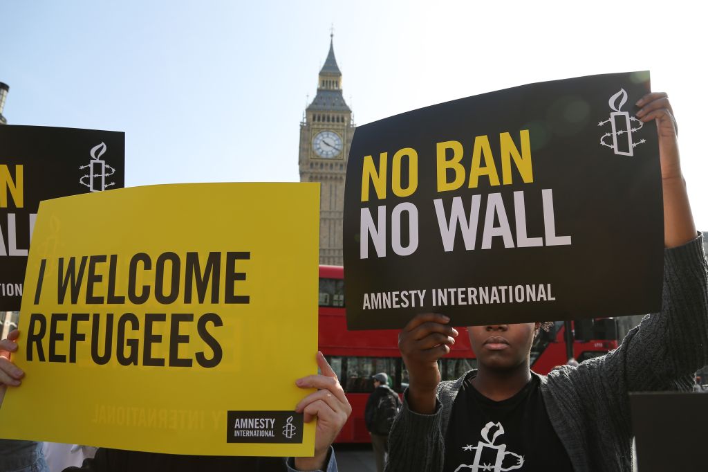 Amnesty International organise Flash Mob protest against Trump's Travel ban