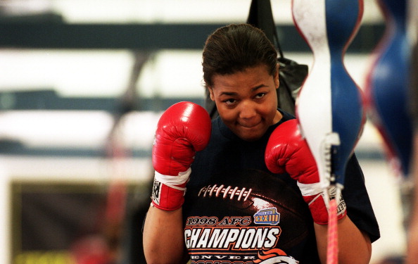 Boxer Freeda Foreman, daughter of former heaveyweight champion George Foreman, warms up during a training session at America Presents Gym in Denver.