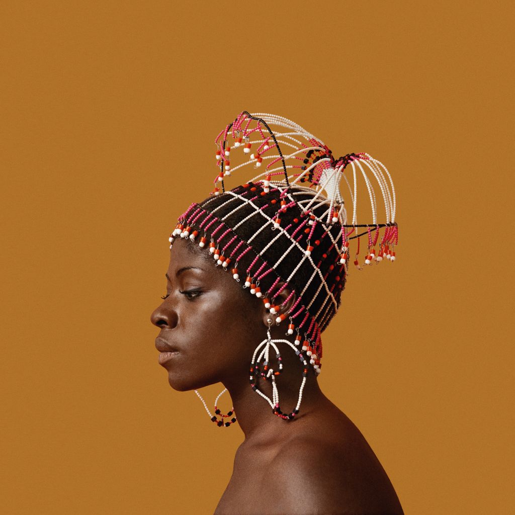 Kwame Brathwaite, Sikolo Brathwaite wearing a headpiece designed by Carolee Prince, African Jazz-Art Society & Studios (AJASS), Harlem, ca. 1968; from Kwame Brathwaite: Black Is Beautiful (Aperture, 2019)