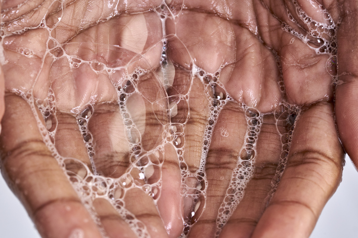 Close up of a black woman hand with soap