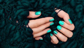 manicure in mint color on the white mint background