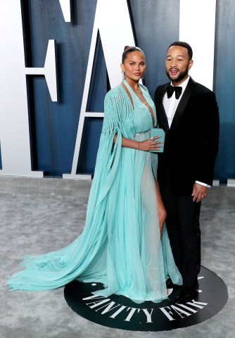 Chrissy Teigen and John Legend arrive at the 2020 Vanity Fair Oscar Party held at the Wallis Annenbe...
