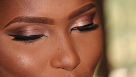 Close-Up Of Woman Wearing Make-Up At Home