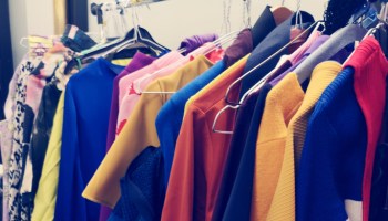 Clothes Hanging On Rack In Store For Sale