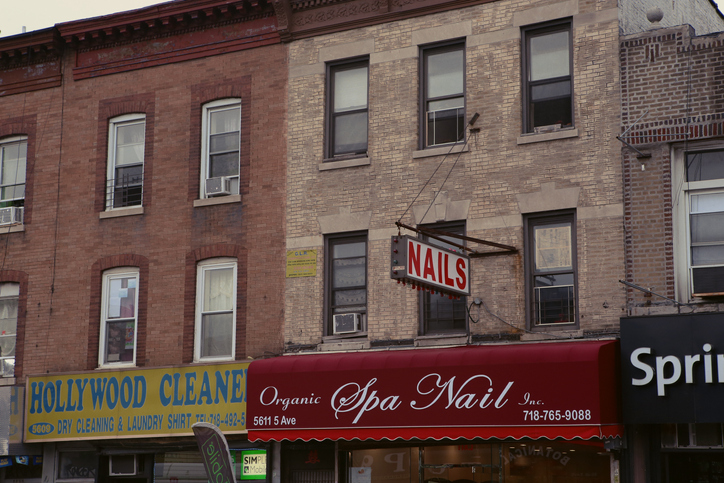 Store signs and canopies in the district of Sunset Park, in Brooklyn, New York City