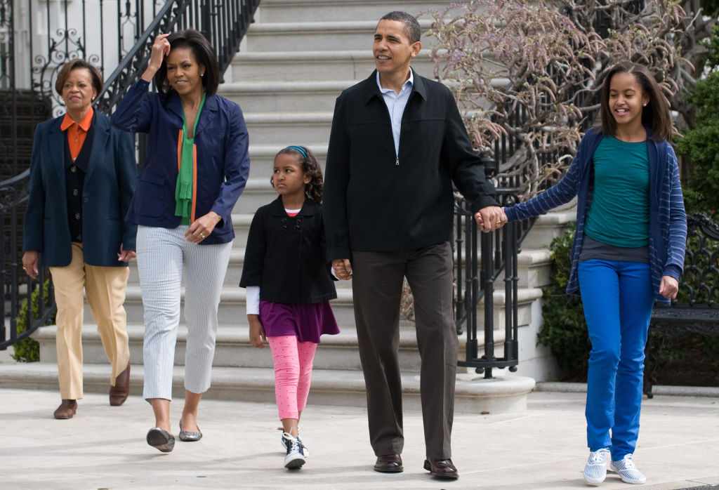 US President Barack Obama walks alongsid