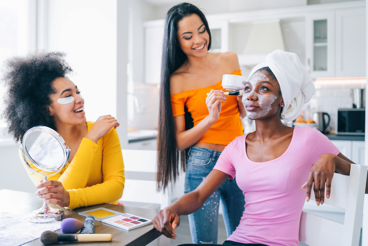 Girls taking good care of their skin and making mask