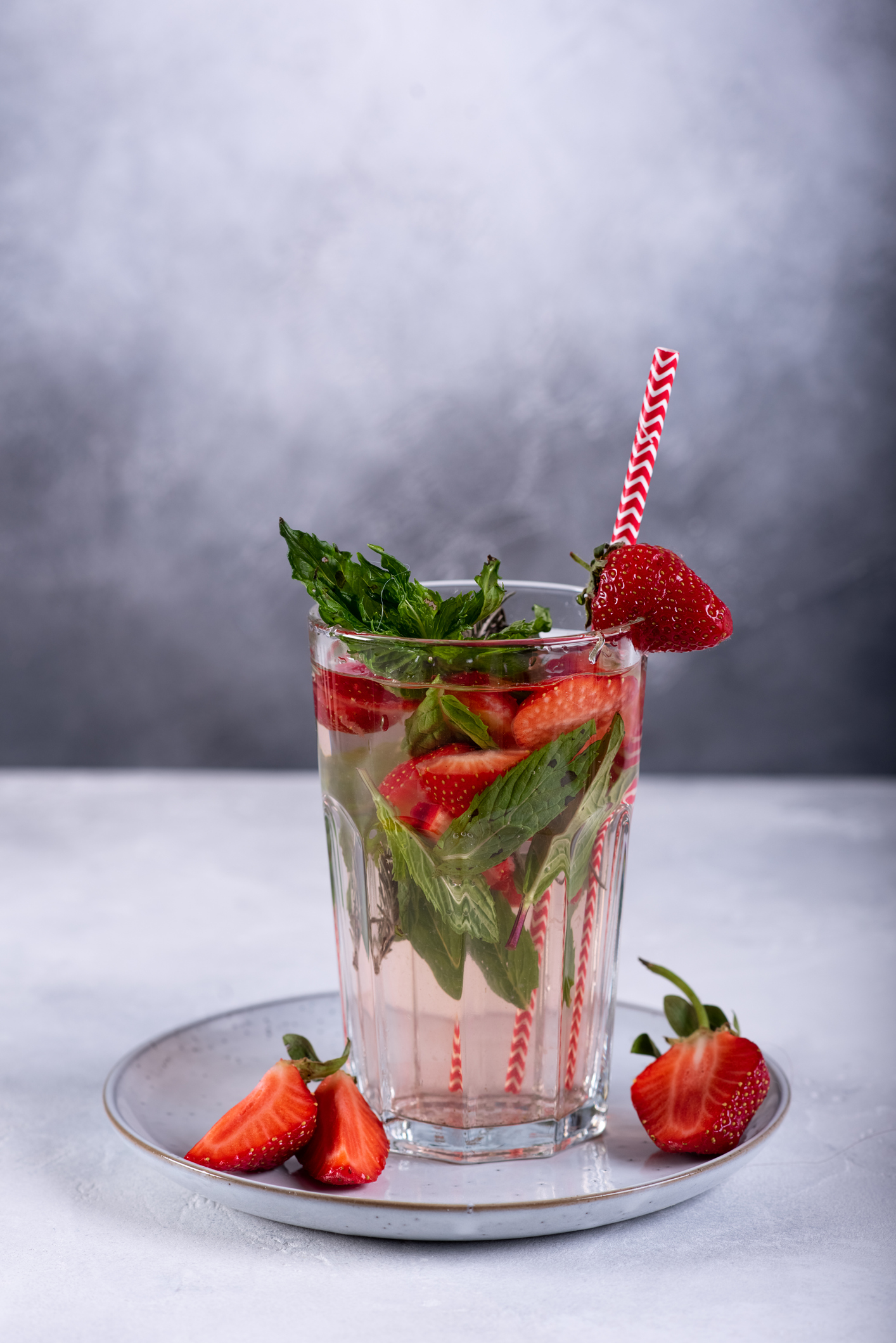 Fresh strawberry mojito or lemonade with mint, selective focus