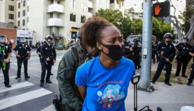 A female protester is arrested in Santa Monica during a...