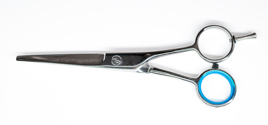 High Angle View Of Scissor Against White Background