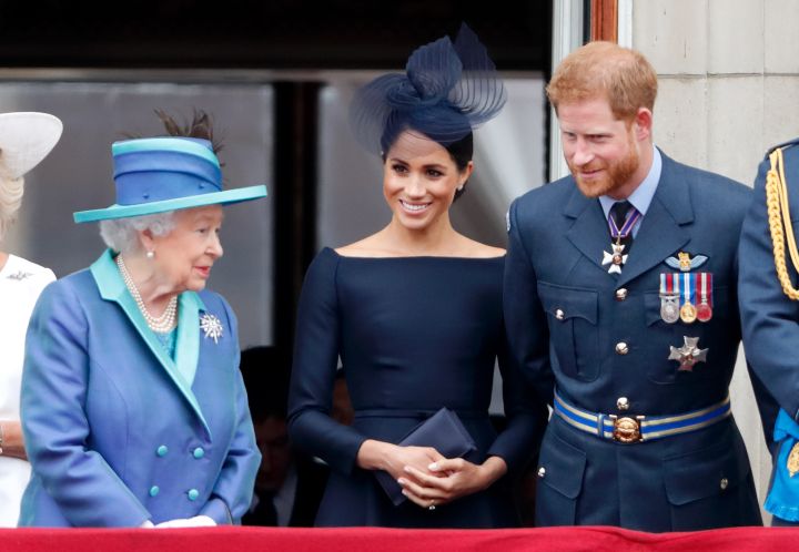 QUEEN ELIZABETH II, MEGHAN MARKLE, AND HER HUSBAND PRINCE HARRY AT THE EVENTS TO MARK THE CENTENARY OF THE ROYAL AIR FORCE, 2018