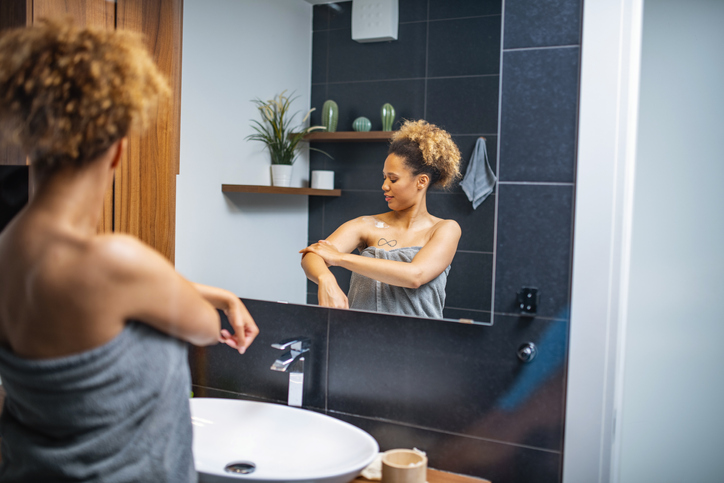 Beautiful Mixed Race African Woman Doing her routine in bathroom