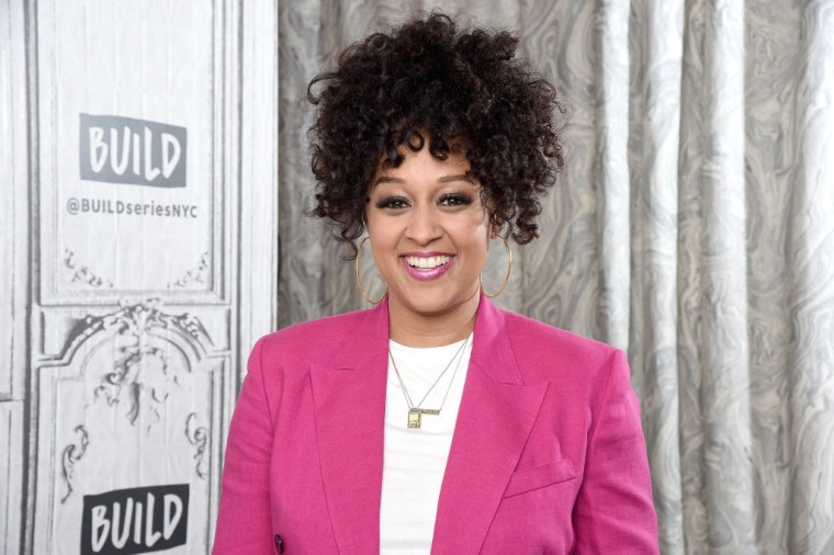Tia Mowry Rocks A Curly Up-Do