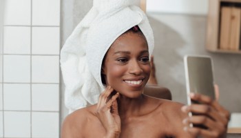 Smiling Woman Taking Selfie After Bath