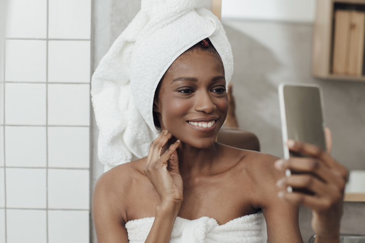 Smiling Woman Taking Selfie After Bath