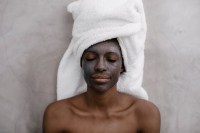 Portrait of a Woman with Charcoal Face Mask