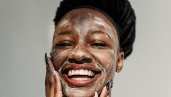 Portrait of a smiling woman with a face mask