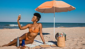 Woman enjoying summertime at the beach