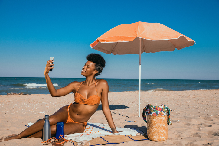 Woman enjoying summertime at the beach