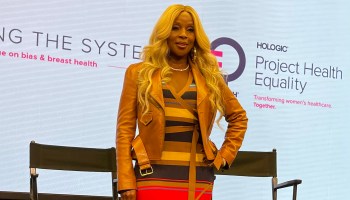 Mary J Blige in tan boots and striped dress at Breast Cancer panel