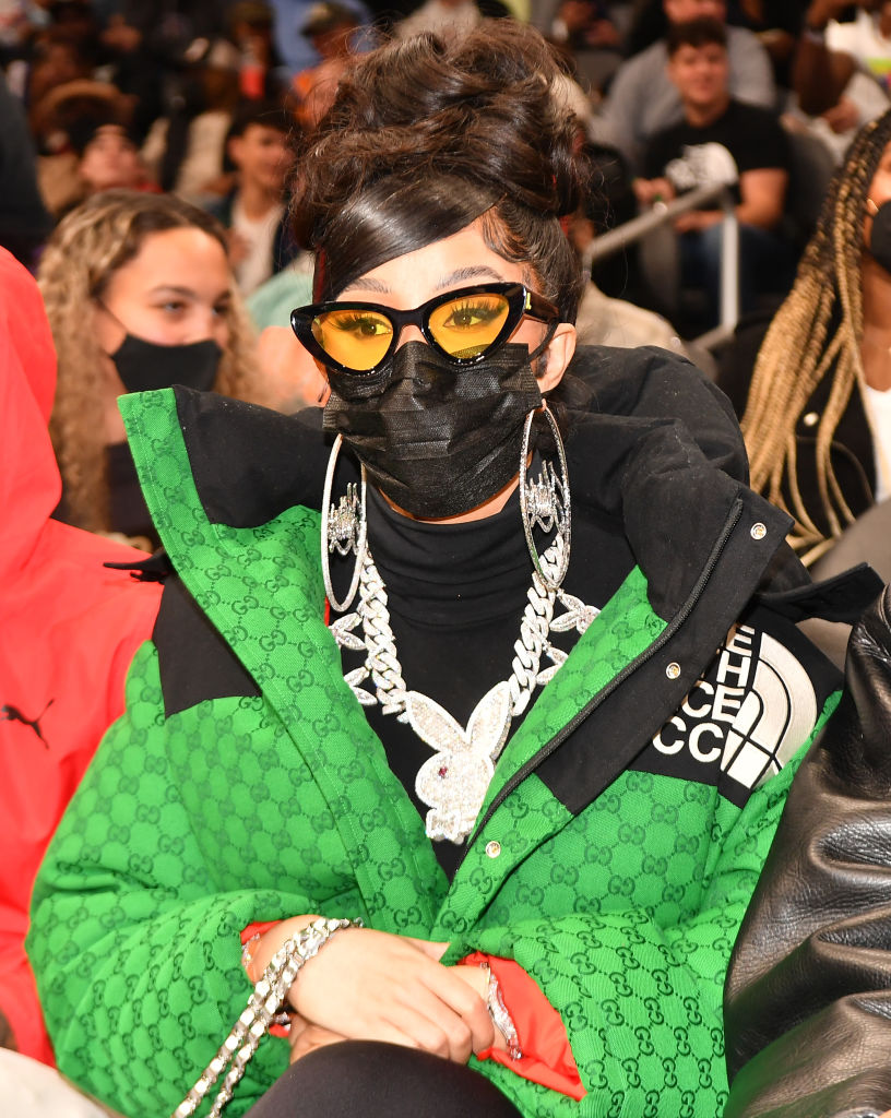 Cardi Brings NYC To Atlanta Hawks Game In A North Face X Gucci