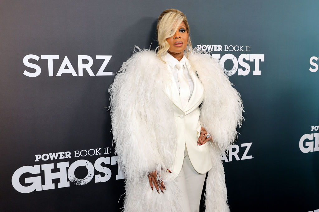 Mary J. Blige dazzles in a ruffled aqua dress as she attends the