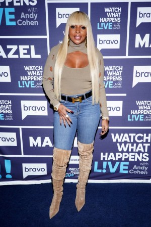 Mary J Blige On Watch What Happens Live With Andy Cohen step and repeat in Tan boots