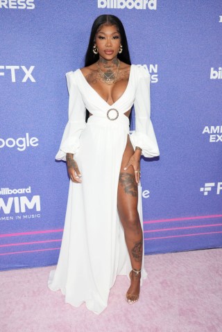 Singer summer walker poses in a white floor-length gown at the Billboard Women In Music event