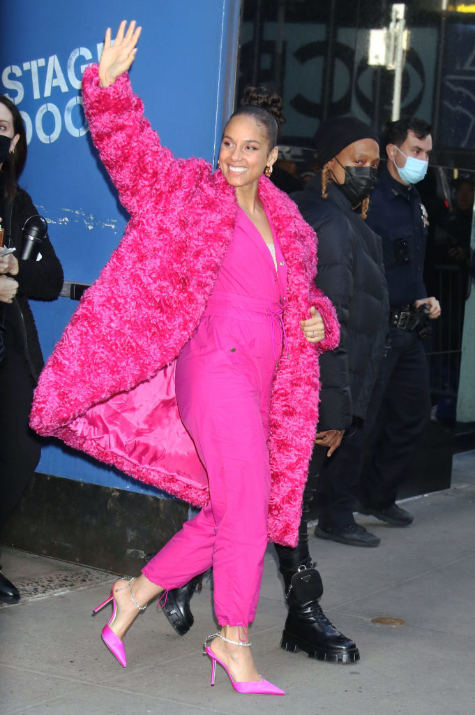 Alicia Keys in hot pink ensemble waving in NYC
