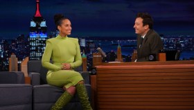 Alicia Keys seated on stage in green dress with Jimmy Fallon on The Tonight Show Starring Jimmy Fallon - Season 9