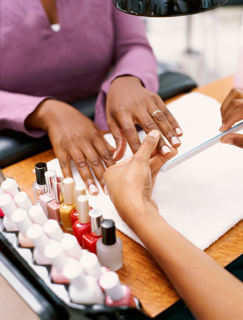 Close-up of a woman having her manicure done