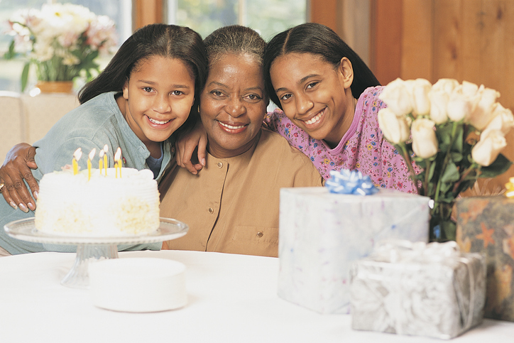 Grandmother and granddaughters celebrating birthday