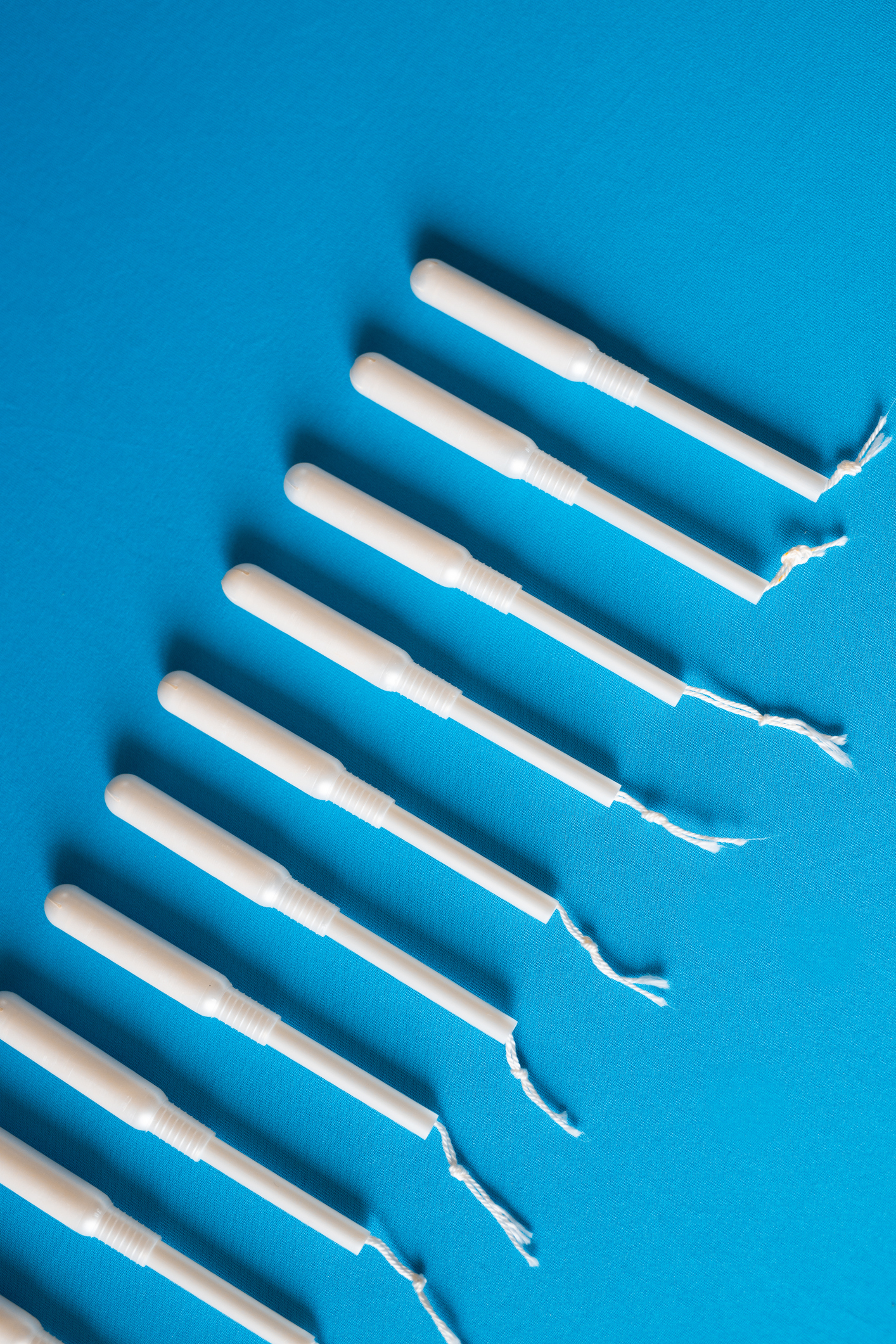 Arrangement of tampons on blue background