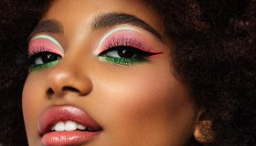Portrait of young afro woman with bright make-up