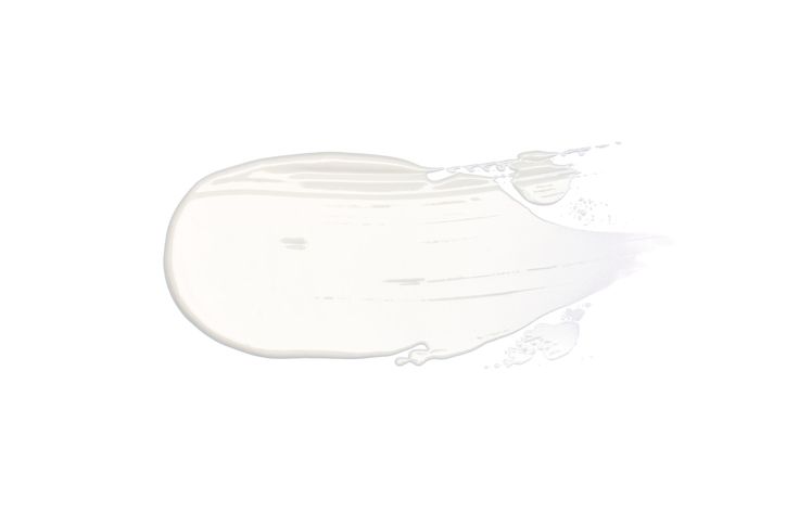 Smooth cosmetic smear of white cream isolated on white background. Concept of health and wellbeing. Flat lay style with copy space
